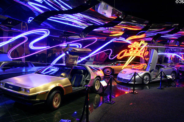 Neon artwork over DeLorean DMC12 & Mercedes Benz McLaren SLR at Petersen Automotive Museum. Los Angeles, CA.
