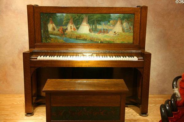 Steinway upright piano with painted western scene once owned by Doheny family at Autry National Center. Los Angeles, CA.