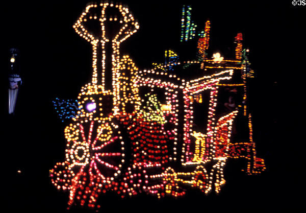 Nighttime lighted float of small locomotive at Disneyland ®. Anaheim, CA.