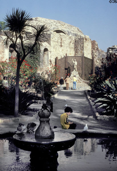 Ruins of second church with gardens of Mission San Juan Capistrano. Capistrano, CA.