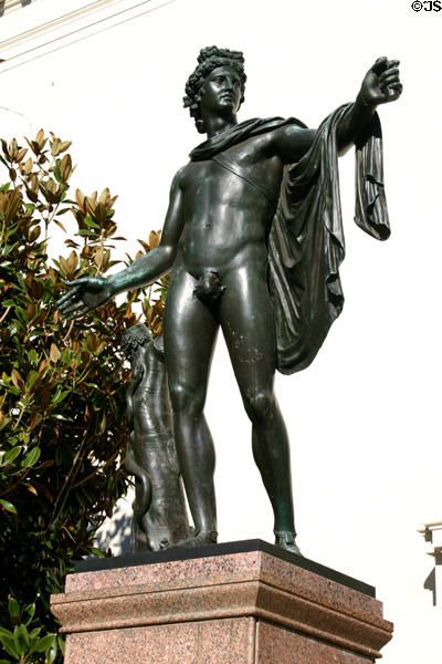 Bronze sculpture of a draped Roman youth by pillar with snake at Henry E. Huntington Library. San Marino, CA.