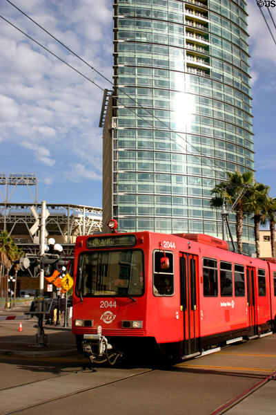 Trolley passes The Metropolitan. San Diego, CA.