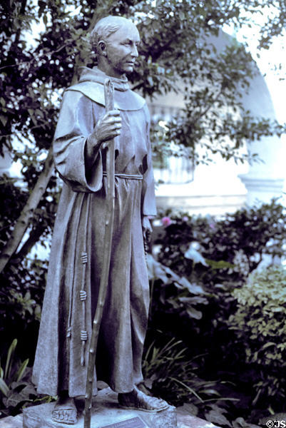 Statue of Padre Junipero Serra (1713-84) founder of the California mission system in garden of San Diego Mission. San Diego, CA.