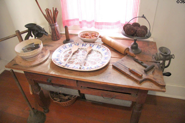 Work table with built-in flour bins & various kitchen appliances at Davis House Museum. San Diego, CA.