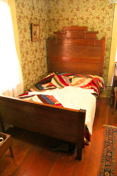Bed with crazy quilt at Davis House Museum. San Diego, CA.