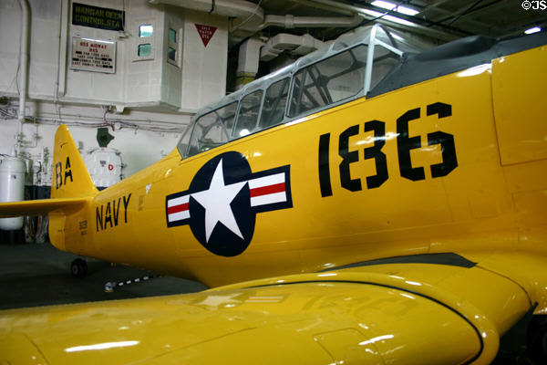 North American Aviation SNJ prop trainer (1940s & 50s) at Midway aircraft carrier museum. San Diego, CA.