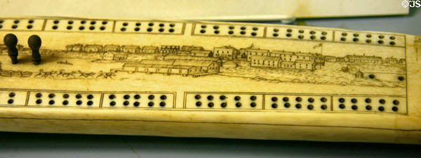 Scrimshaw cribbage board with scene of Alaska at Maritime Museum. San Diego, CA.