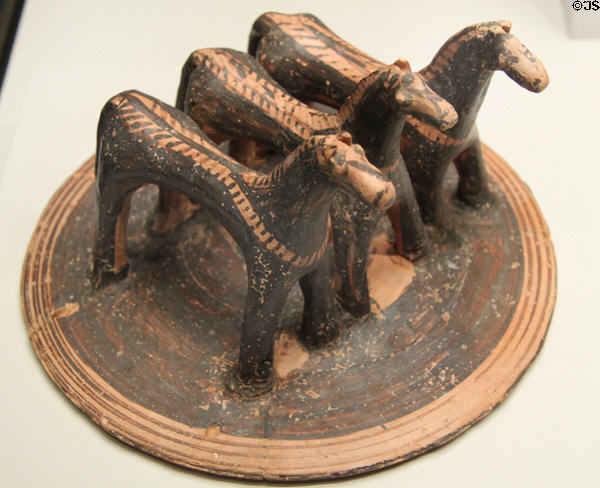 Greek terracotta pyxis lid with three horses (760-750 BCE) from Boiotia at Getty Museum Villa. Malibu, CA.