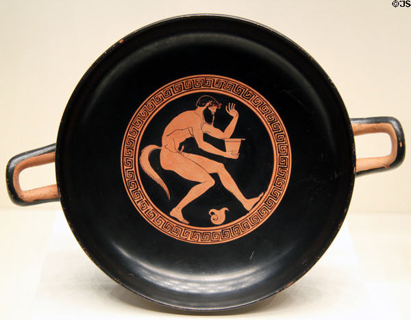 Greek terracotta red-figure wine cup (kylix) with crouching Satyr (c480 BCE) from Athens at Getty Museum Villa. Malibu, CA.