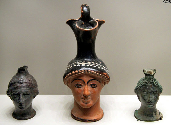 Greek terracotta & bronze oil vessels shaped as female heads (c470-1 BCE) at Getty Museum Villa. Malibu, CA.