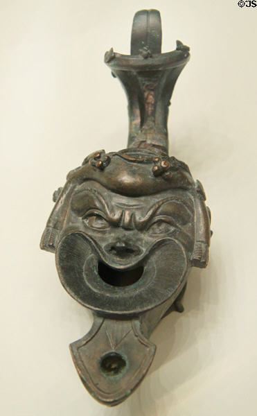 Roman bronze lamp is shape of comic actor (75-125 CE) at Getty Museum Villa. Malibu, CA.