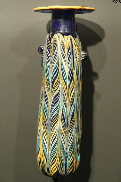 Greek blue glass perfume bottle (Alabastron) with white, yellow & turquoise feathered decoration (400-200 BCE) at Getty Museum Villa. Malibu, CA.