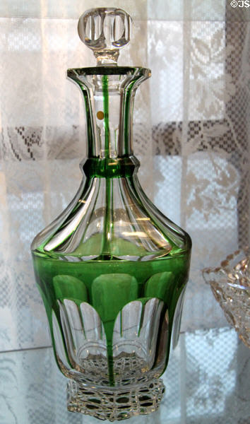 Green overlay cut to clear glass decanter in colonial style at Historical Glass Museum. Redlands, CA.