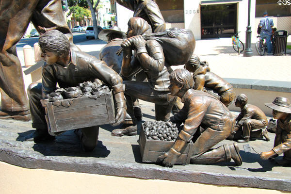 Detail of fruit pickers on Cesar E. Chavez Memorial (2013) by Ignacio Gomez on Main St. Mall. Riverside, CA.