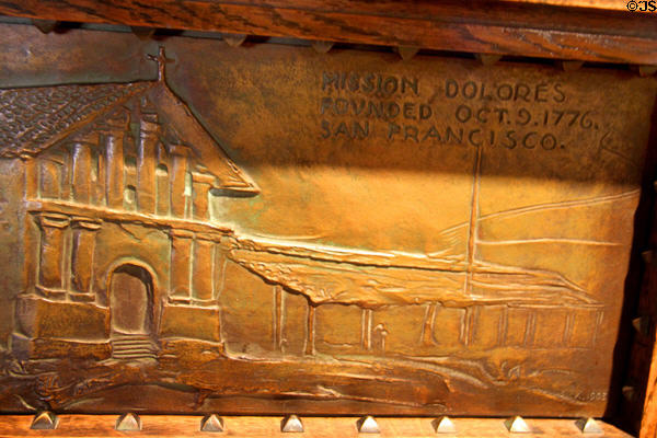 Bronze inlay showing Mission Dolores of San Francisco on upright piano (c1906) by Bryon Mauzy at Mission Inn Museum. Riverside, CA.