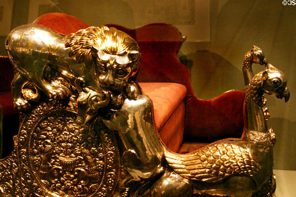 India: gilded wood throne with lions, bulls & peacocks from Surguja (1870-1920) in Asian Art Museum. San Francisco, CA.