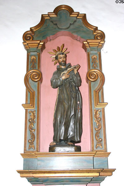 Statue of St Francis of Assisi with crucifix (c1920) in Mission Dolores chapel. San Francisco, CA.