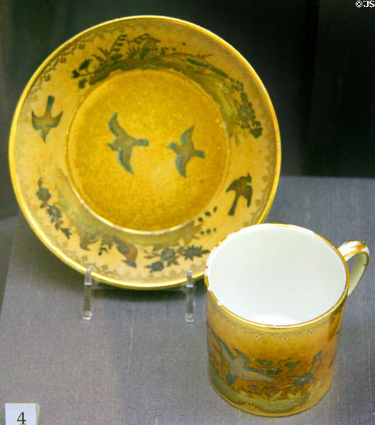 Gilded porcelain cup & saucer in caramel (1779) from Sèvres, France at Legion of Honor Museum. San Francisco, CA.