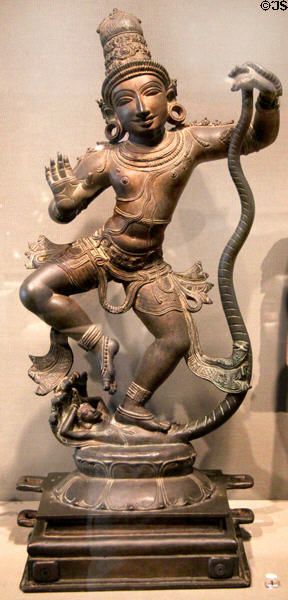 Hindu deity Krishna overcoming Kaliya bronze sculpture (1400-1500) from Tamil Nadu, India at Asian Art Museum. San Francisco, CA.