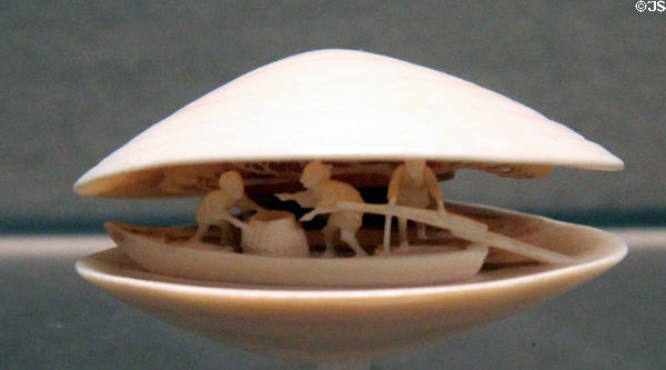 Netsuke of three boatmen & pine on clamshell (c1800-1900) from Japan at Asian Art Museum. San Francisco, CA.