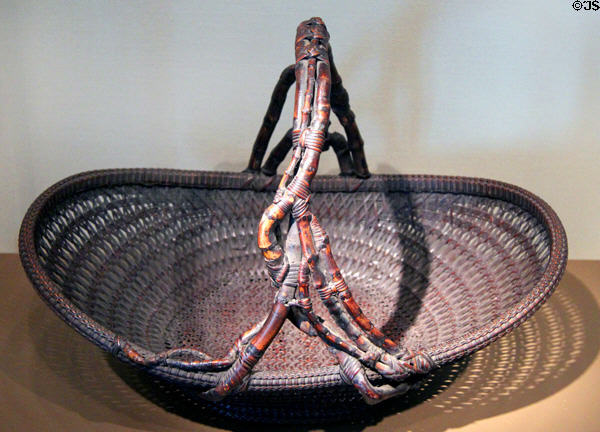 Shallow woven flower basket (c1900-50) by Maeda Chikubosai I from Japan at Asian Art Museum. San Francisco, CA.