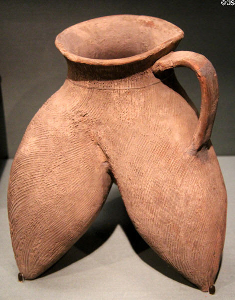 Neolithic earthenware tripod vessel with single handle (c2800-2000 BCE) from Shaanxi, China at Asian Art Museum. San Francisco, CA.