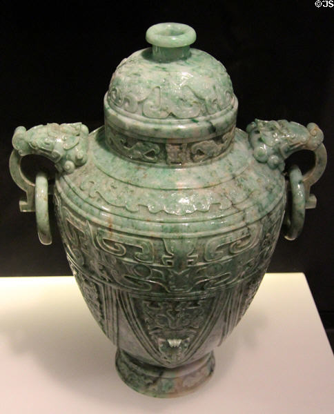 Carved jadeite covered vase with ring handles (1900-49) from China at Asian Art Museum. San Francisco, CA.