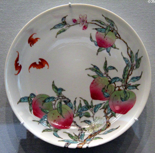 Porcelain plate painted with peaches & bats (1736-95) from China at Asian Art Museum. San Francisco, CA.