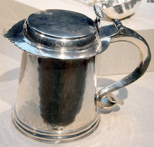 Silver hinged tankard (c1720) by Simeon Soumain of New York at de Young Museum. San Francisco, CA.