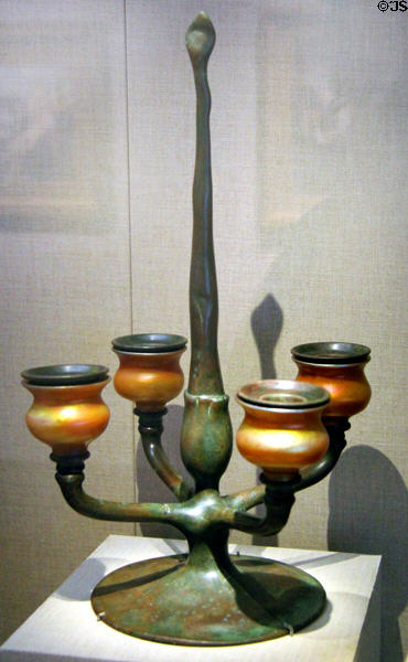 Four-candle Favrile glass & bronze candelabra (c1920) by studio of Louis Comfort Tiffany at de Young Museum. San Francisco, CA.