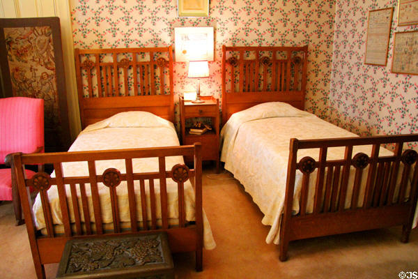 Middle bedroom with Arts & Crafts furniture at Haas-Lilienthal House. San Francisco, CA.
