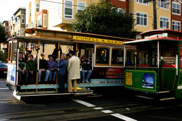 Cable cars passing each other. San Francisco, CA.