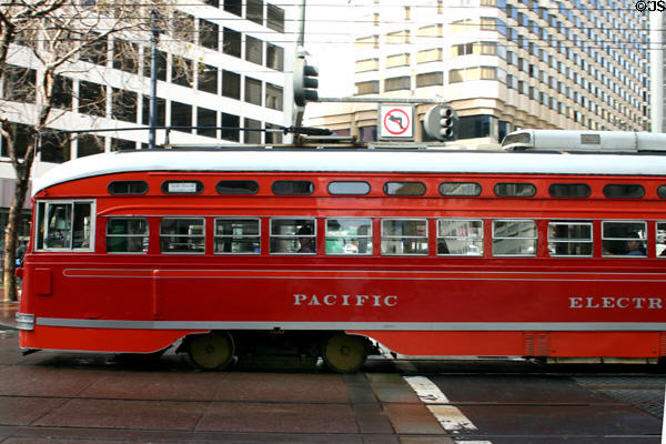 Antique PCC streetcar on Market Street with Pacific Electric paint scheme. San Francisco, CA.