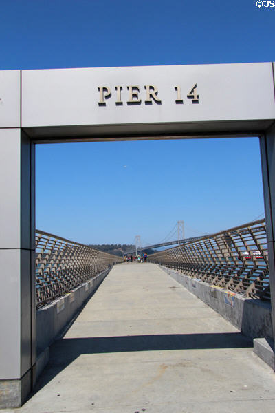 Pier 14 walkway & Oakland Bay Bridge. San Francisco, CA.