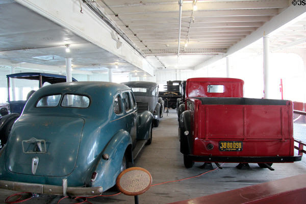 Antique vehicles on Eureka ferry boat auto deck at Maritime National Historical Park. San Francisco, CA.