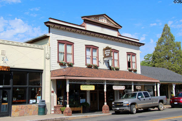 Mariposa Hotel Inn (1901) with shops below. Mariposa, CA.