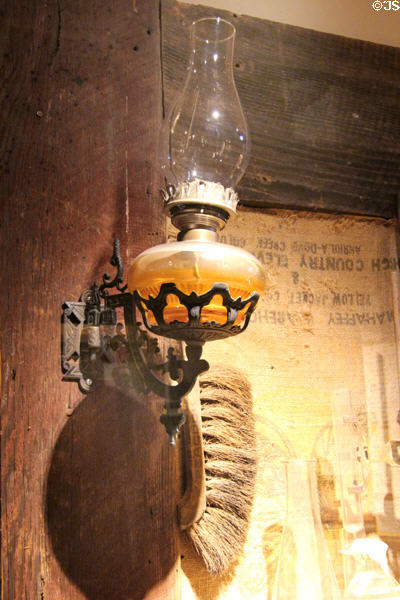 Glass kerosene wall lamp at Mariposa Museum. Mariposa, CA.