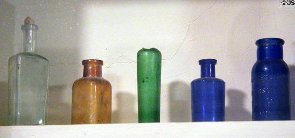 Antique colored glass bottles at Northern Mariposa County Museum. Coulterville, CA.