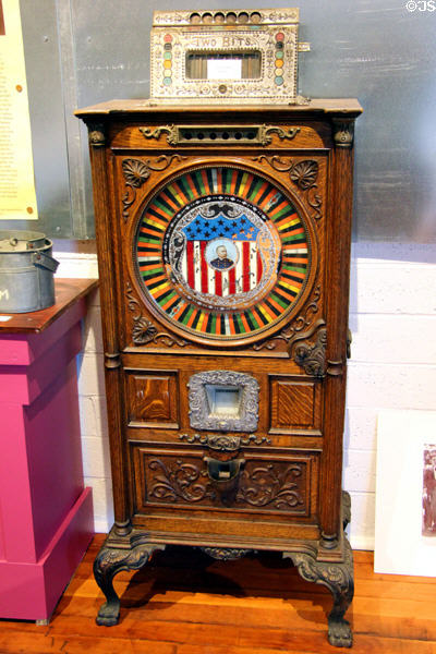 Antique ornate wooden slot machine with image of Admiral Dewey (early 1900's) at Angels Camp Museum. Angels Camp, CA.