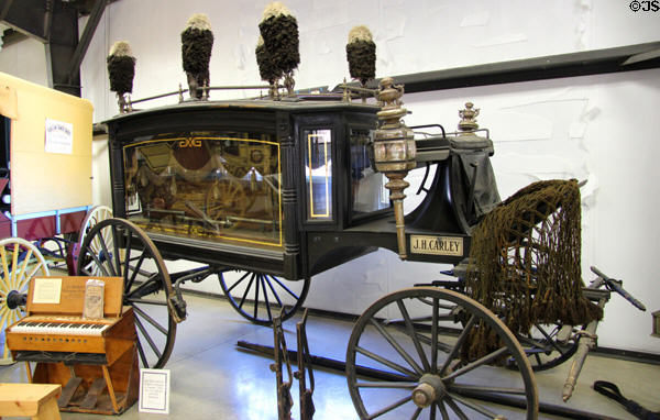 Hearse carriage (1880), built by Rock Falls Manufacturing Co., Sterling IL & used by John H. Carley of Angels Camp in his undertaking business; the black & white plumes indicate deceased was a middle aged person at Angels Camp Museum. Angels Camp, CA.