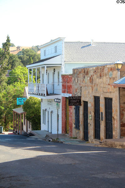 View of heritage buildings lining hill on North Main St. San Andreas, CA.
