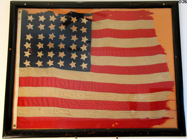 Heritage U.S. flag with 36 stars (1865-87) after Nevada joined USA in courtroom at Calaveras County Downtown Museum. San Andreas, CA.