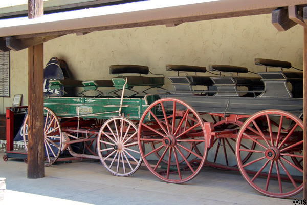 Three-bench passenger wagons (one by ELI by Columbia Wagon) at El Dorado County Historical Museum. Placerville, CA.