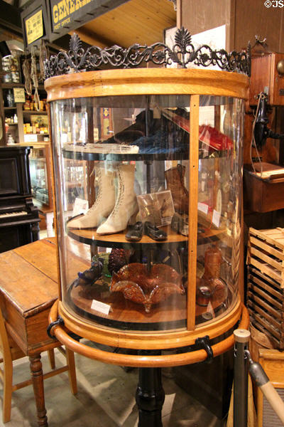 Vitrine displaying vintage footwear & carnival glass at El Dorado County Historical Museum. Placerville, CA.