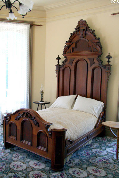 Wooden bedstead at Bidwell Mansion house museum. Chico, CA.