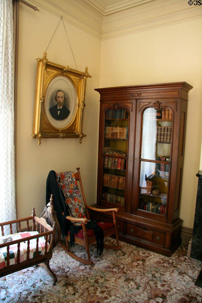 Bedroom with cradle, rocker & book case at Bidwell Mansion house museum. Chico, CA.