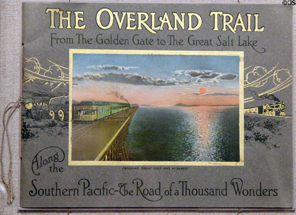 Overland Trail book by Southern Pacific railroad with photo of railway crossing Great Salt Lake at Oakland Museum of California. Oakland, CA.