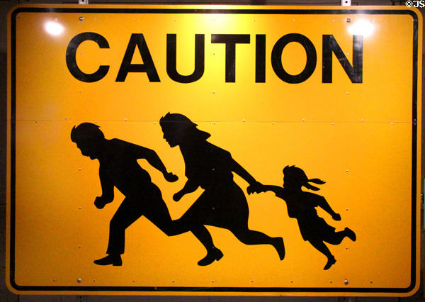 Sign used to warn freeway drivers near San Diego of illegal immigrants from Mexico at Oakland Museum of California. Oakland, CA.