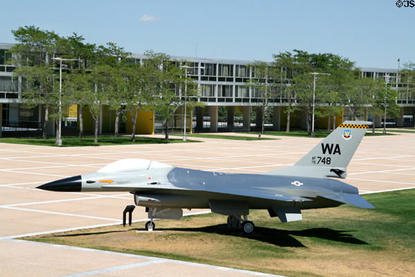 Vandenberg Hall dormitory of USAF Academy over General Dynamics F-16A Fighting Falcon jet aircraft. Colorado Springs, CO.