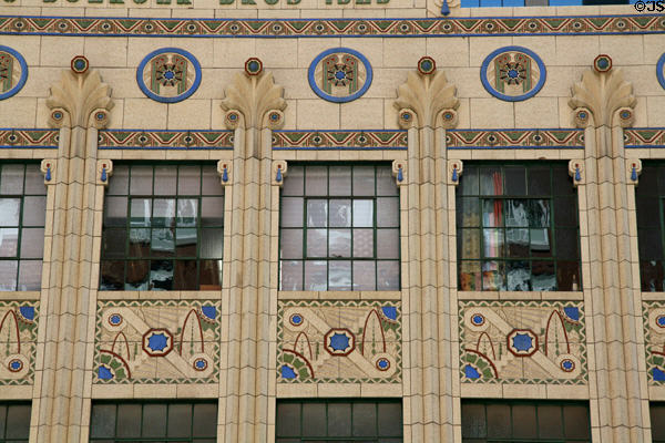Colorful terra cotta details of Buerger Brothers Beauty Supply Company building. Denver, CO.